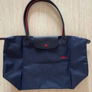 Longchamp red and blue pliage bag. Purchased from Bloomingdales.